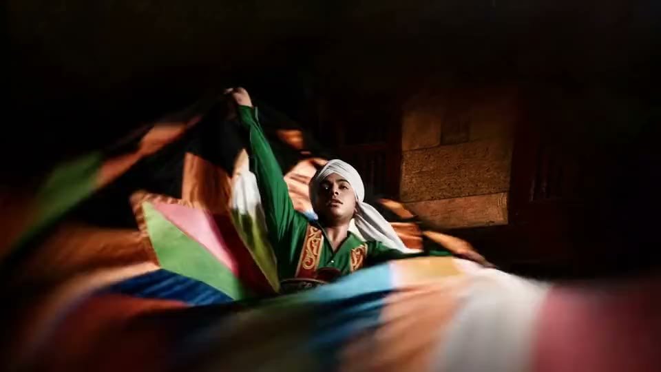 Egyptian Tanoura dancer whirling a multicoloured skirt