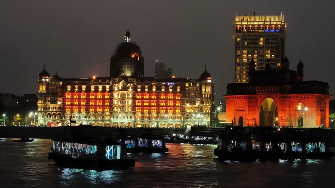 Taj Mahal Palace hotel and the Gateway of India lit at night in Mumbai